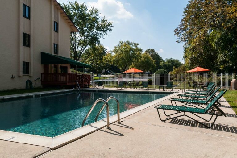 The Metropolitan East Goshen - swimming pool with lounge chairs