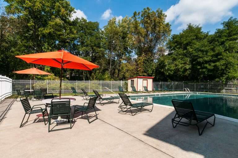The Metropolitan East Goshen - swimming pool with tables and lounge chairs