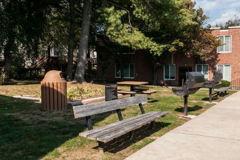 The Metropolitan Roxborough - property exterior BBQ area with benches and tables